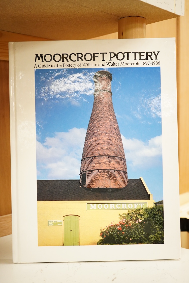 A Moorcroft for Liberty & Co. Flamminion Ware vase, and a smaller Moorcroft vase glazed in a mottled plum flambe, the first 20cm., also to include two Moorcroft reference books